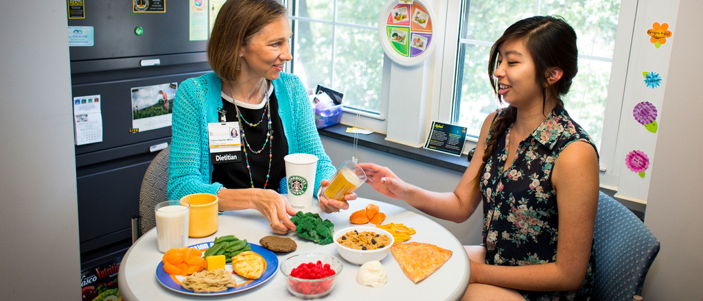A student meeting with a Student Health employee