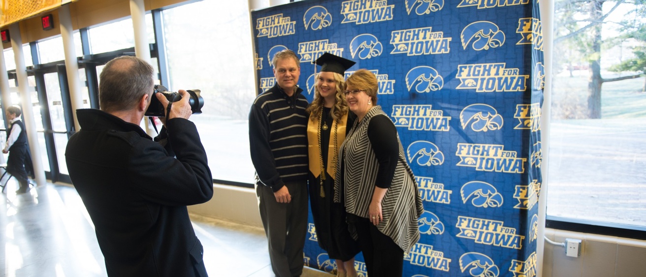 A family and a student posing for a photo at graduation